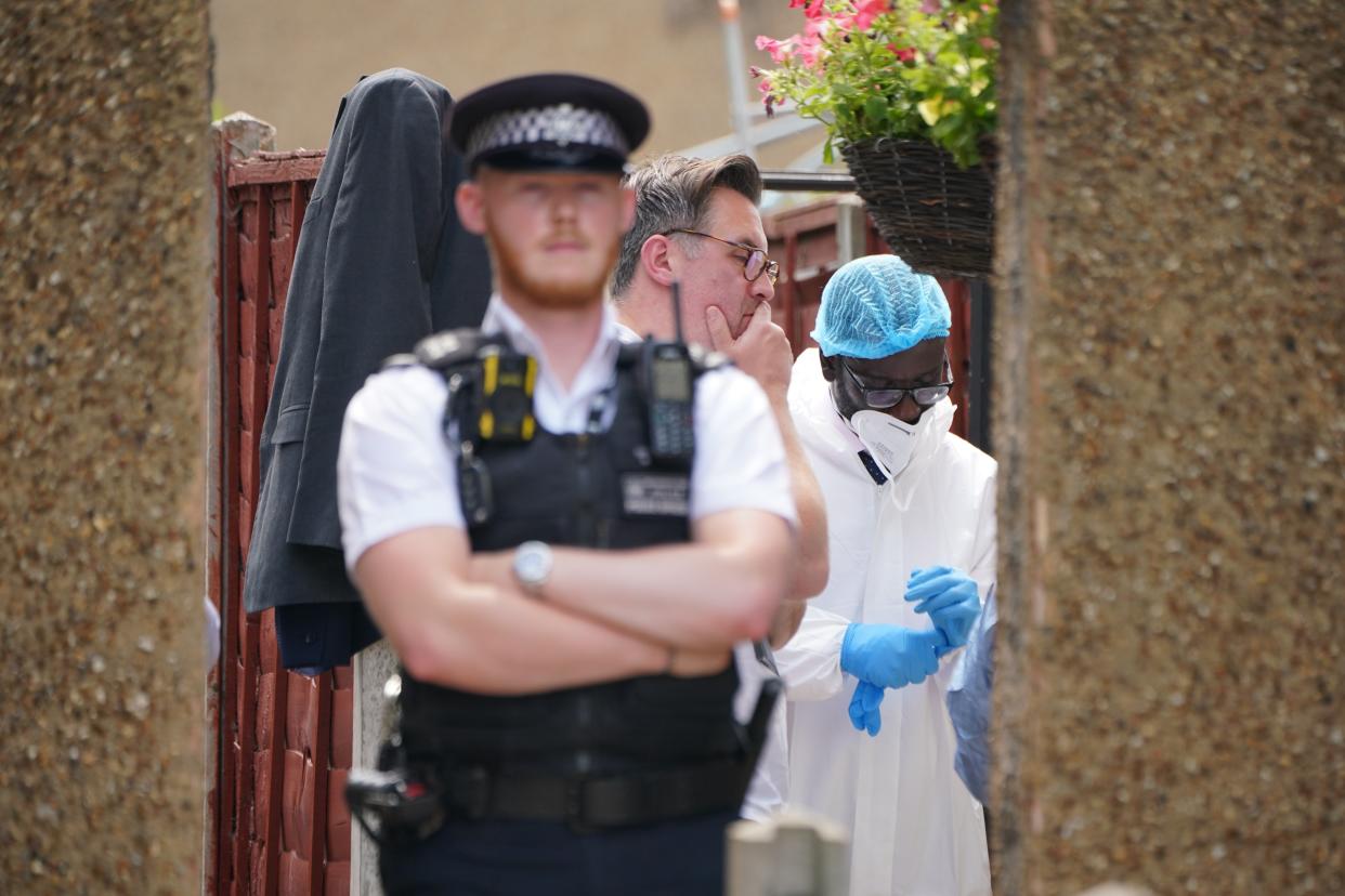 Police and forensic investigators at the scene in Bedfont, Hounslow (Lucy North/PA Wire)