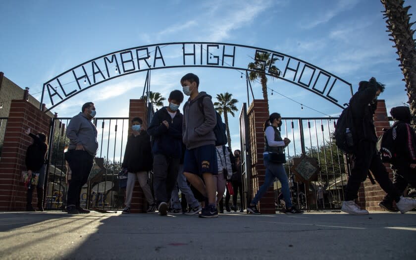 ALHAMBRA, CA - January 03 2022: Alhambra High School students head off for the day after the final bell rang on Monday, Jan. 3, 2022 in Alhambra, CA. (Brian van der Brug / Los Angeles Times