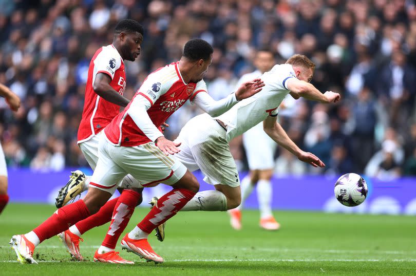 Dejan Kulusevski is challenged in the box during the Premier League match between Tottenham Hotspur and Arsenal FC at Tottenham Hotspur Stadium.