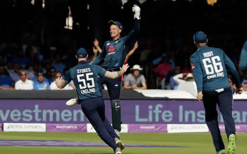 Jos Buttler celebrates a catch - Credit: AP