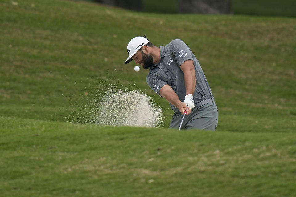 Jon Rahm, of Spain, hits from a fairway bunker on the first hole during the second round of the Dell Technologies Match Play Championship golf tournament in Austin, Texas, Thursday, March 23, 2023. (AP Photo/Eric Gay)