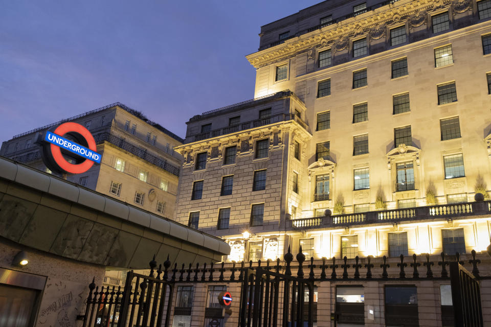 Residential flats and apartments overlook the illuminated roundel of London Underground's Green Park tube station and the iron gates of Green Park that leads downhill towards Buckingham Palace, on 3rd February 2021, in London, England. (Photo by Richard Baker / In Pictures via Getty Images)