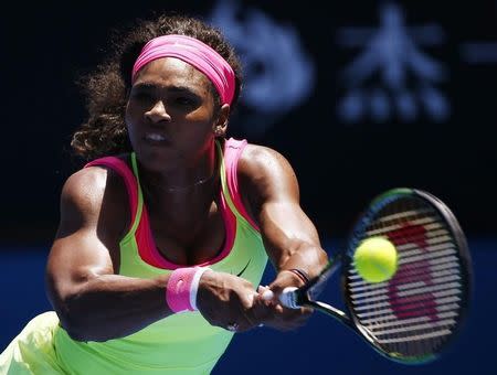 Serena Williams of the U.S. hits a return to Vera Zvonareva of Russia during their women's singles second round match at the Australian Open 2015 tennis tournament in Melbourne January 22, 2015. REUTERS/Issei Kato