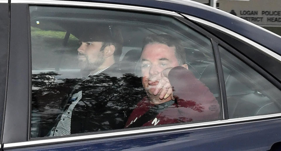 Luke Smith is seen being driven from the Logan Police Headquarters in July last year following a disturbance. Source: AAP/Darren England, file