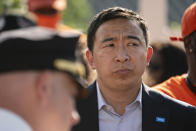 New York City mayoral candidate Andrew Yang attends a vigil at the scene where 10-year old Justin Wallace was shot and killed the previous Saturday night in the Rockaway section of the Queens borough of New York, Wednesday, June 9, 2021. The Democratic primary race for New York City mayor is nearing the finish line with a surge in shootings pushing public safety to the top of some voters' concerns. (AP Photo/John Minchillo)