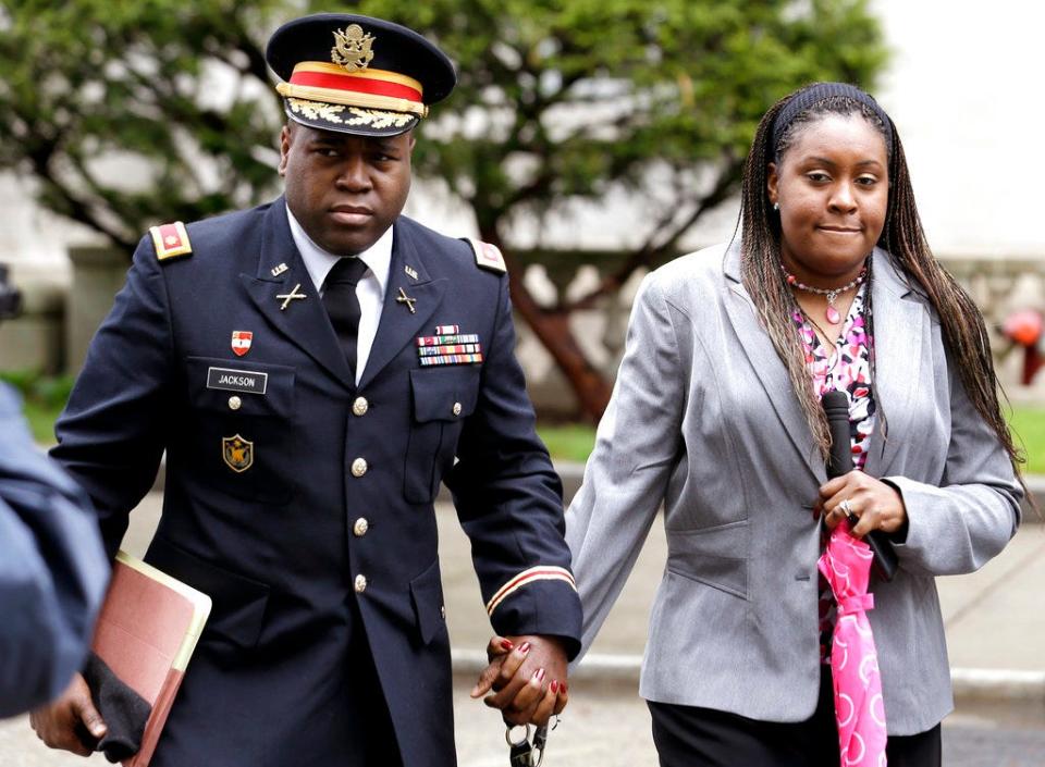 In this May 9, 2013, file photo, John Jackson, left, and his wife Carolyn Jackson, of Mount Holly, N.J., walk out of Martin Luther King, Jr. Courthouse in Newark, N.J.