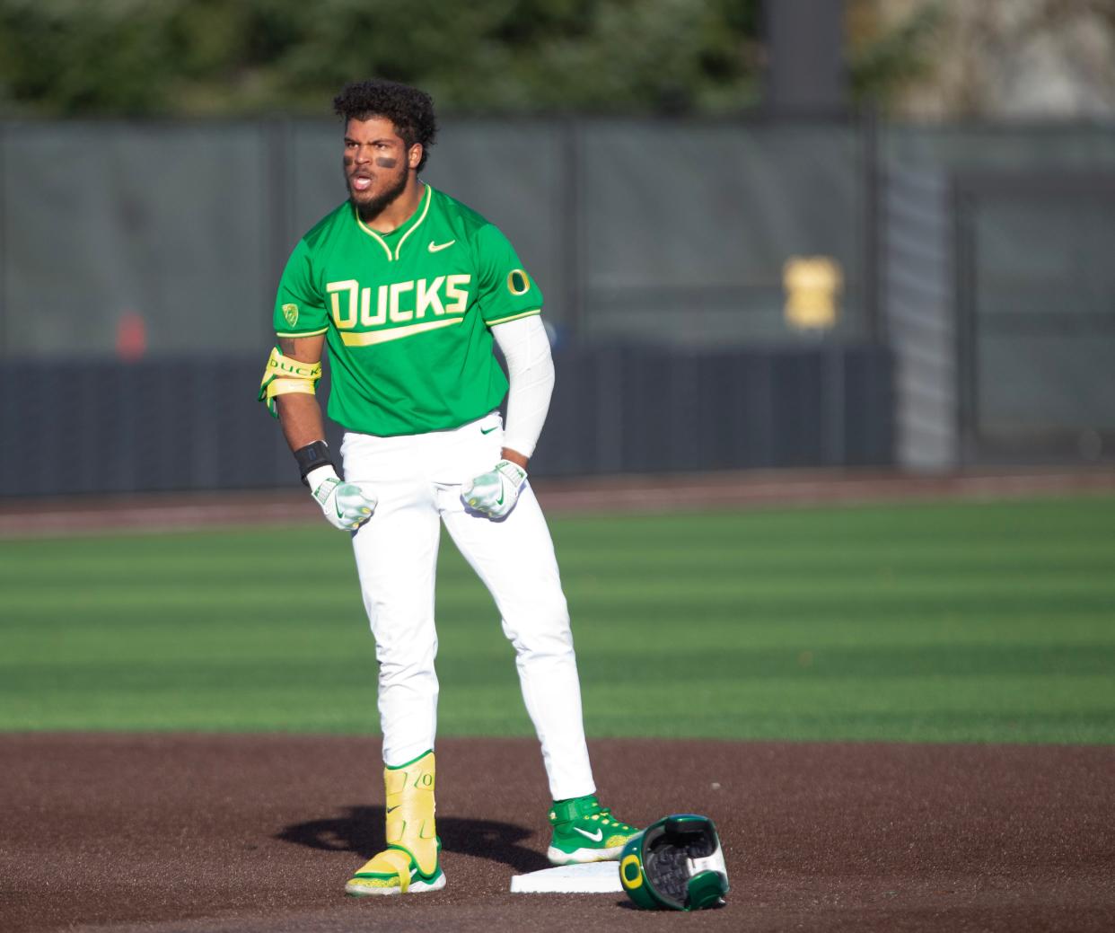 Oregon’s Jacob Walsh, left, celebrates a hit against Lafayette's Michael Zarrillo at PK Park in Eugene Friday, Feb. 23, 2024.