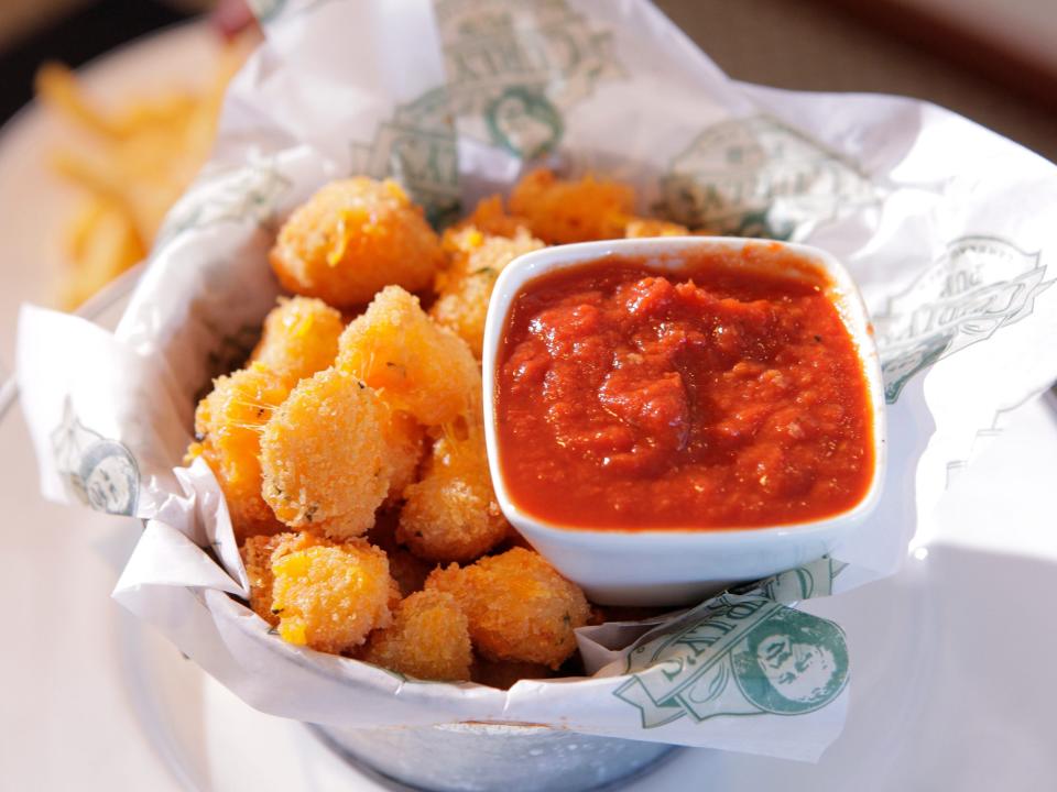 Fried cheese curds with tomato sauce