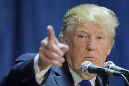 U.S. Republican presidential candidate Donald Trump takes a question from the audience at one of the New England Council's "Politics and Eggs' breakfasts in Manchester, New Hampshire in this November 11, 2015 file photo. REUTERS/Brian Snyder/Files