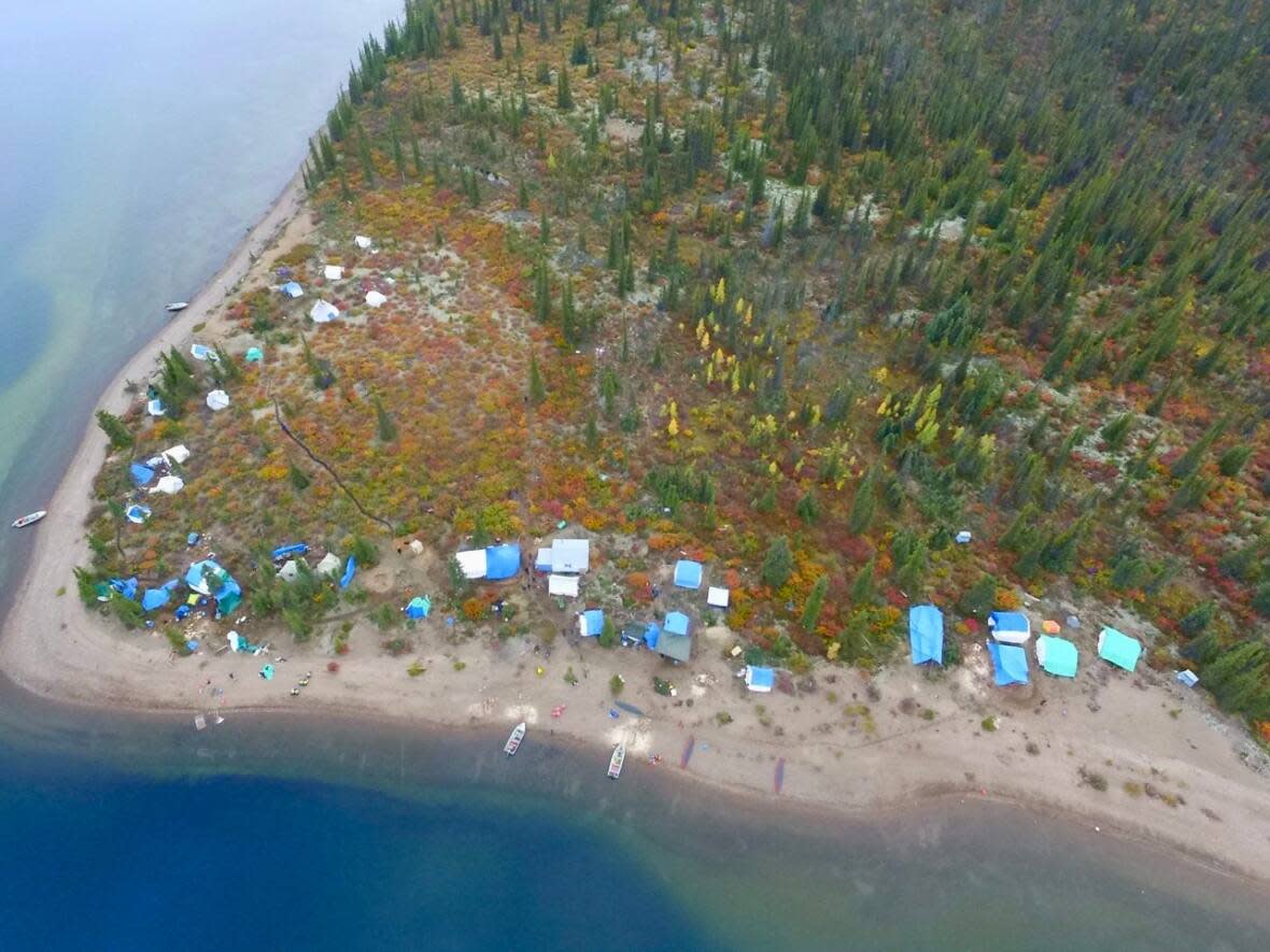 The culture camp at Timber Bay. About 80 Łutsel K'e Dene First Nation members were taking part in a culture camp on the lake when wildlife officers executed what the First Nation describes as an 'invasive' search for illegally hunted caribou.  (Submitted by Iris Catholique - image credit)