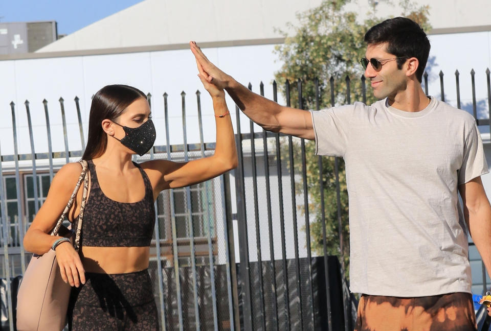 <p><em>Dancing with the Stars </em>partners Nev Schulman and Jenna Johnson arrive for practice in L.A. on Tuesday. </p>