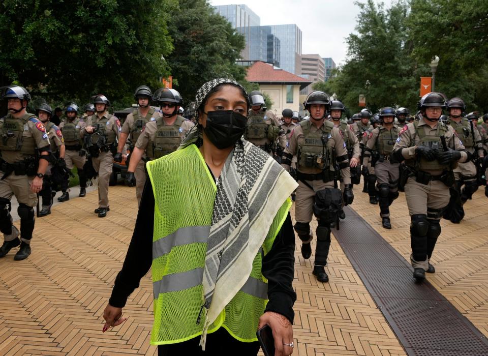 State troopers try to break up a pro-Palestinian protest at the University of Texas Wednesday April 24, 2024.