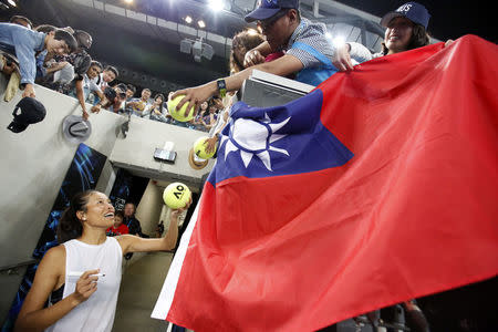 Tennis - Australian Open - Margaret Court Arena, Melbourne, Australia, January 20, 2018. Taiwan's Su-Wei Hsieh signs autographs after winning her match against Poland's Agnieszka Radwanska. REUTERS/Issei Kato