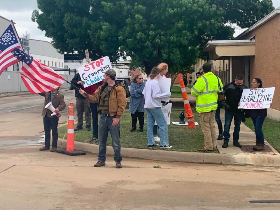 Members of anti-LGBT groups Protect Texas Kids and the New Columbia Movement gather across the street from a drag brunch Sunday to protest.