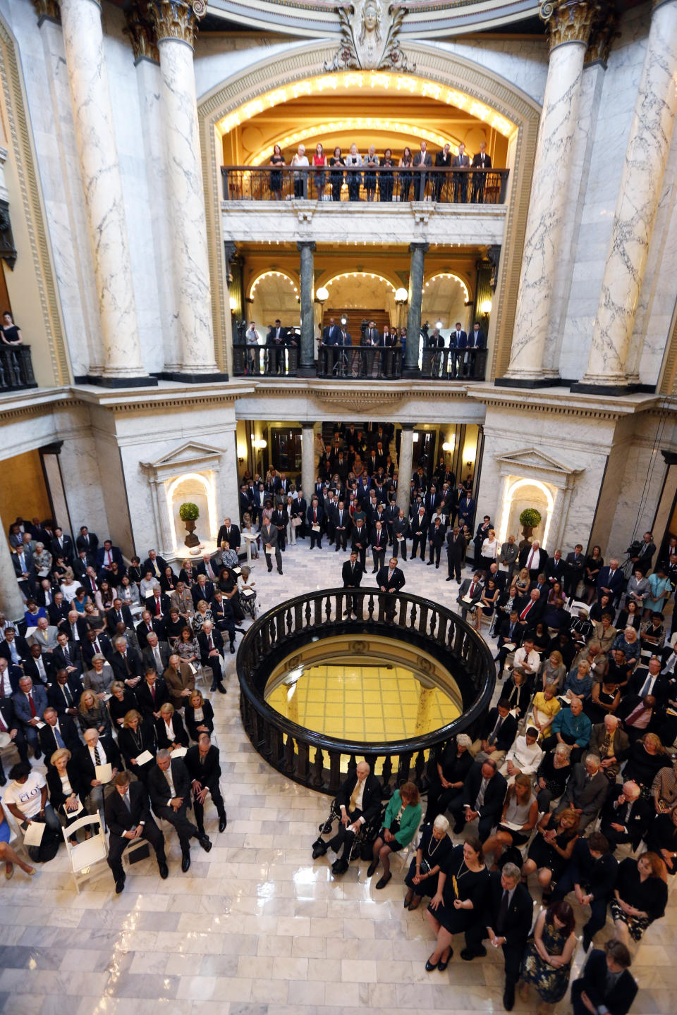 Well-wishers, friends, public officials and relatives pack the rotunda at the Mississippi state Capitol in Jackson, Miss., for the first of two funeral services for the late Republican Sen. Thad Cochran, in Jackson, Miss., Monday, June 3, 2019. Cochran was 81 when he died Thursday in a veterans' nursing home in Oxford, Mississippi. (AP Photo/Rogelio V. Solis)