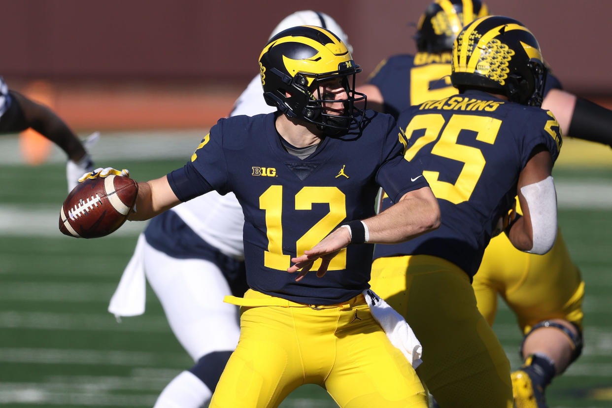 ANN ARBOR, MICHIGAN - NOVEMBER 28: Cade McNamara #12 of the Michigan Wolverines throws a first half pass against the Penn State Nittany Lions at Michigan Stadium on November 28, 2020 in Ann Arbor, Michigan. (Photo by Gregory Shamus/Getty Images)