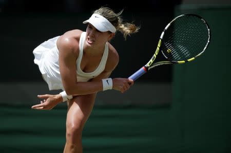 Eugenie Bouchard of Canada serves during her women's singles quarter-final tennis match against Angelique Kerber of Germany at the Wimbledon Tennis Championships, in London July 2, 2014. REUTERS/Max Rossi