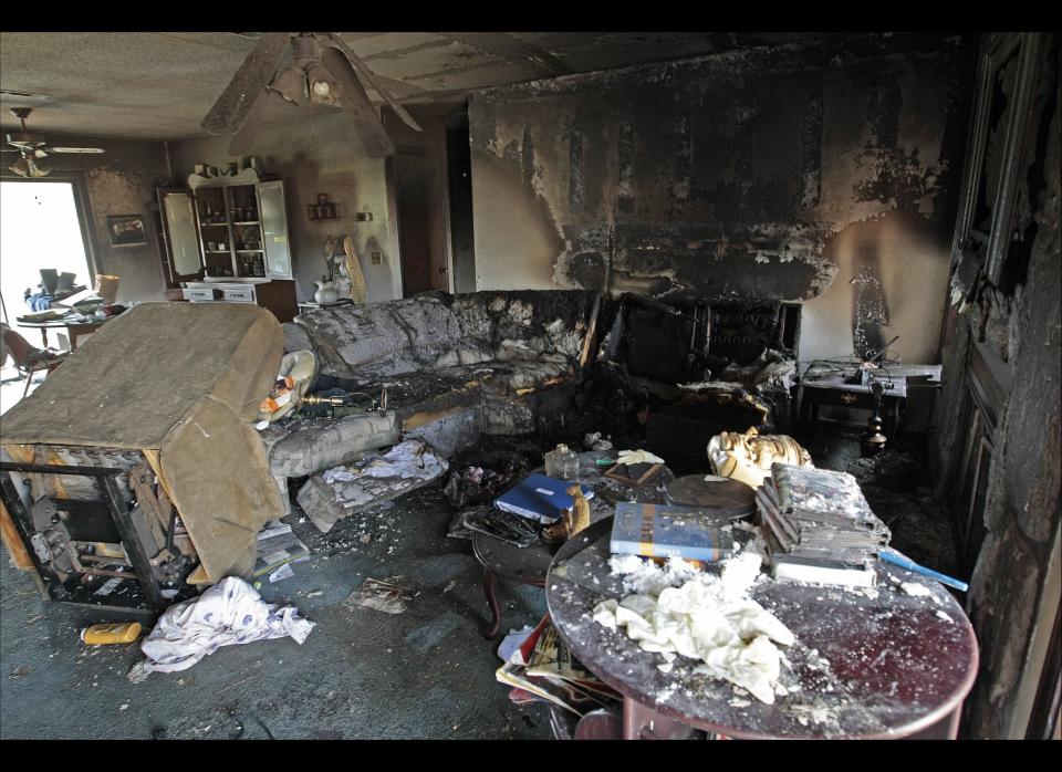 The charred Kinston, Ala. living room where suspected gunman Michael McLendon allegedly killed his mother Lisa McLendon, is photographed Wednesday, March 11, 2009. Authorities were working Wednesday to learn why a gunman set off on a rampage, killing 10 people across two rural Alabama counties. 