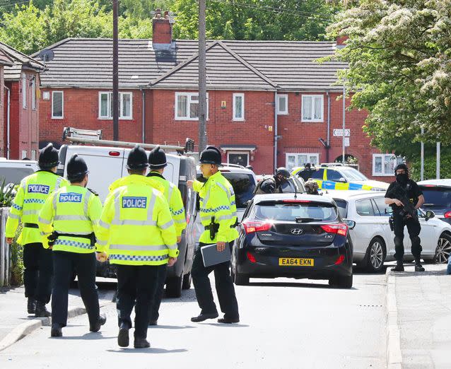 Police carry out raids on a Greater Manchester property. Source: PA