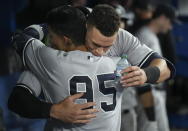 New York Yankees' Aaron Judge, rear, celebrates with Oswaldo Cabrera after his 61st home run of the season, a two-run shot against the Toronto Blue Jays during the seventh inning of a baseball game Wednesday, Sept. 28, 2022, in Toronto. (Nathan Denette/The Canadian Press via AP)