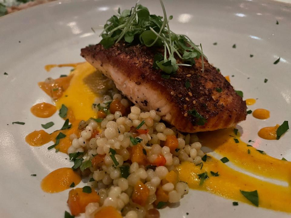 Wester Ross salmon at Uproot, a dish that includes Za'atar blackened salmon with Israeli couscous, smoked tomato and butternut puree with roasted onions and bell peppers.