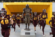 Arizona State Sun Devils players run past the Pat Tillman statue before the college football game against the Oregon Ducks at Sun Devil Stadium on September 23, 2017 in Tempe, Arizona. (Photo by Christian Petersen/Getty Images)