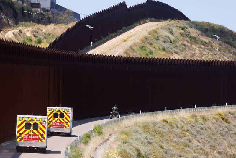 Migrants gather along the U.S. Mexico border near San Diego before the lifting of Title 42