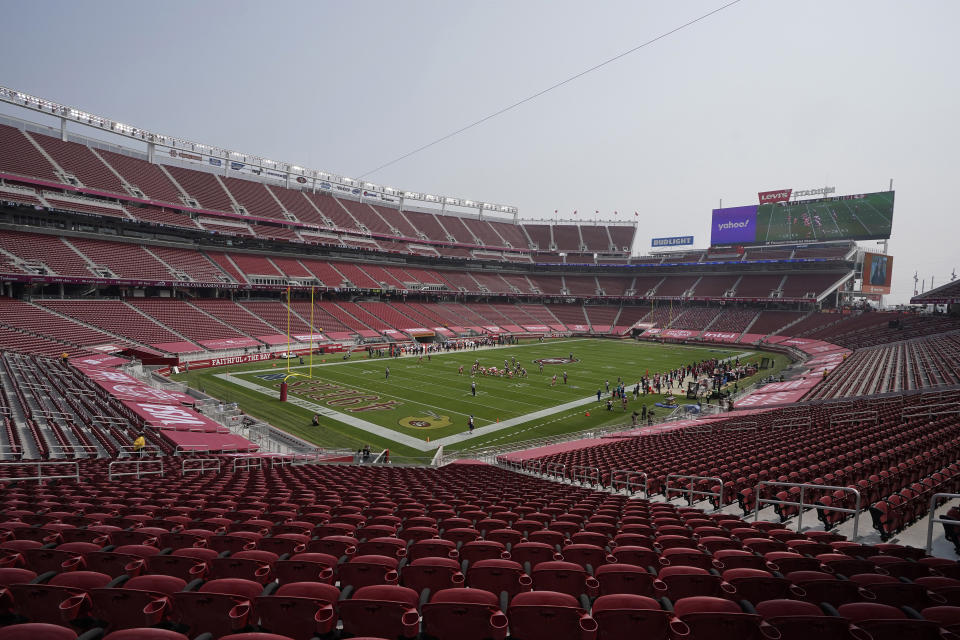 FILE - In this Sept. 13, 2020, file photo, empty seats are shown at Levi's Stadium during the first half of an NFL football game between the San Francisco 49ers and the Arizona Cardinals in Santa Clara, Calif. California health officials announced Tuesday, Oct. 20, 2020, that they will allow a limited number of fans to attend professional sporting events in counties with lower rates of transmission of the coronavirus. That includes Santa Clara County, home to the San Francisco 49ers professional football team, but health officials there said they won't allow fans at such events anytime soon. (AP Photo/Jeff Chiu, File)