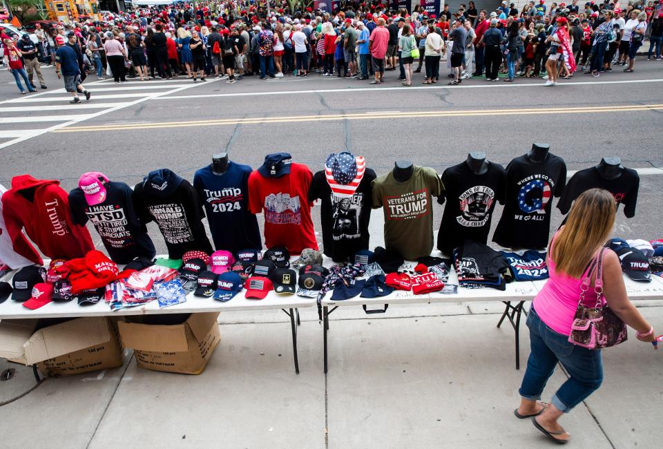 One of several merchandise tables outside the Arizona Federal Theatre, where former President Donald J. Trump will hold the Rally to Protect Our Elections! sponsored by Turning Point Action in Phoenix, July 24, 2021. Benjamin Chambers/The Republic