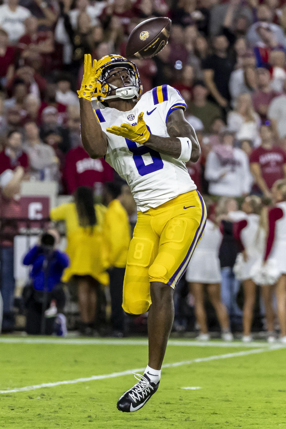 LSU wide receiver Malik Nabers catches a pass and scores a touchdown against Alabama during the first half of an NCAA college football game, Saturday, Nov. 4, 2023, in Tuscaloosa, Ala. (AP Photo/Vasha Hunt)