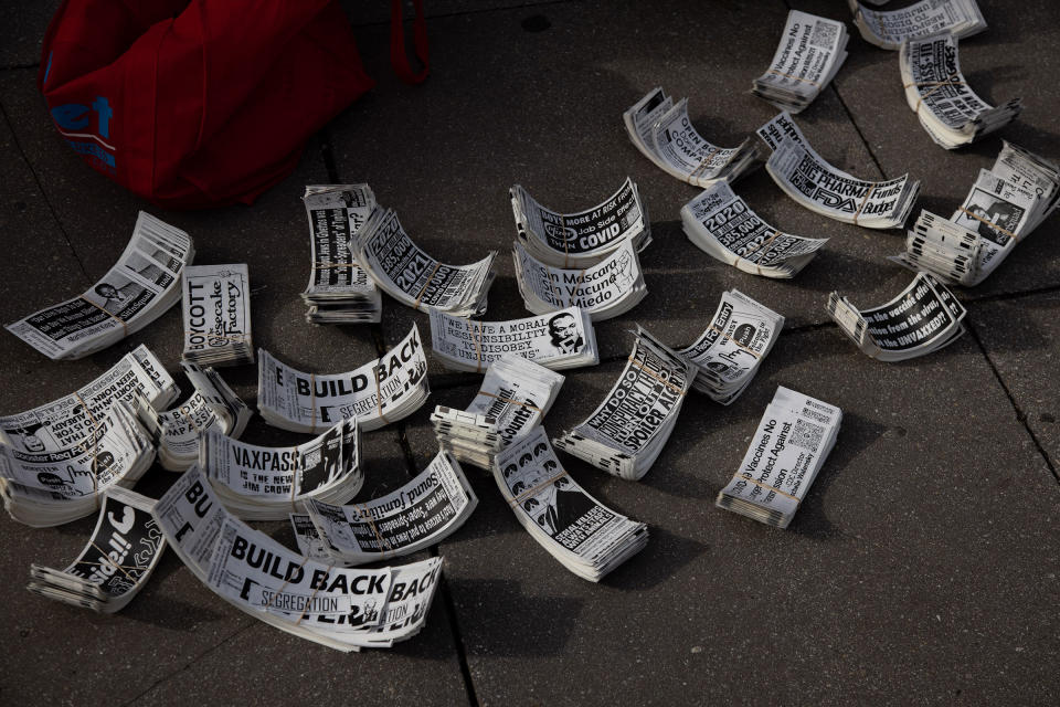 Stickers lay on the ground at the Defeat the Mandates rally on Jan. 23, 2022.<span class="copyright">Bryan Olin Dozier—Reuters</span>
