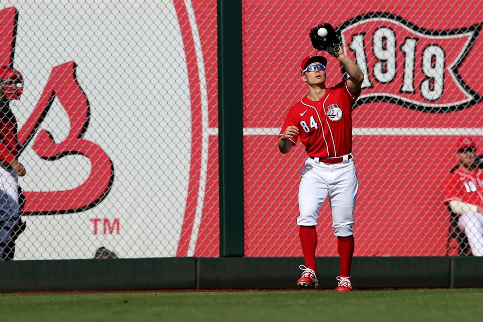 Cincinnati Reds non-roster invitee outfielder Stuart Fairchild (84) catches a fly ball in the seventh inning during a Cactus League spring training baseball game, Sunday, Feb. 23, 2020, at Goodyear Ballpark in Goodyear, Ariz.