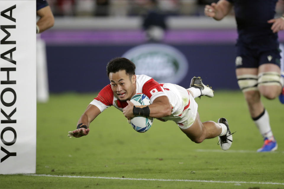 FILE - In this Oct. 13, 2019, file photo, Japan's Kenki Fukuoka scores a try during the Rugby World Cup Pool A game at International Stadium against Scotland in Yokohama, Japan. Fukuoka will retire after playing for the Panasonic Wild Knights against Suntory Sungoliath in the final of Japan's Top League club competition on Sunday May 23. (AP Photo/Jae Hong, File)