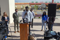 Former New Mexico State NCAA college basketball player Shak Odunewu, center, speaks at a news conference in Las Cruces, N.M., Wednesday, May 3, 2023. Odunewu and former Aggie player Deuce Benjamin discussed the lawsuit they filed alleging teammates ganged up and sexually assaulted them multiple times, while their coaches and others at the school didn't act when confronted with the allegations. (AP Photo/Andres Leighton)