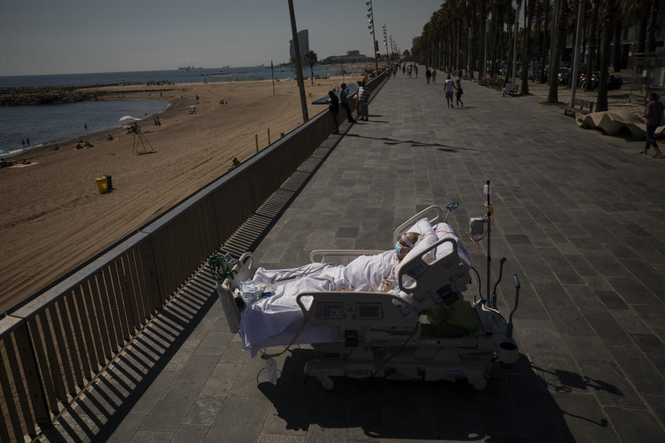 Francisco España, 60, looks at the Mediterranean sea from a promenade next to the "Hospital del Mar" in Barcelona, Spain, Sept. 4, 2020. Francisco spent 52 days in the ICU of the hospital due to an infection of Coronavirus and he has being allowed by his doctors on this day to spend almost ten minutes at the seaside as part of a therapy to recover from the ICU. The image was part of a series by Associated Press photographer Emilio Morenatti that won the 2021 Pulitzer Prize for feature photography. (AP Photo/Emilio Morenatti)