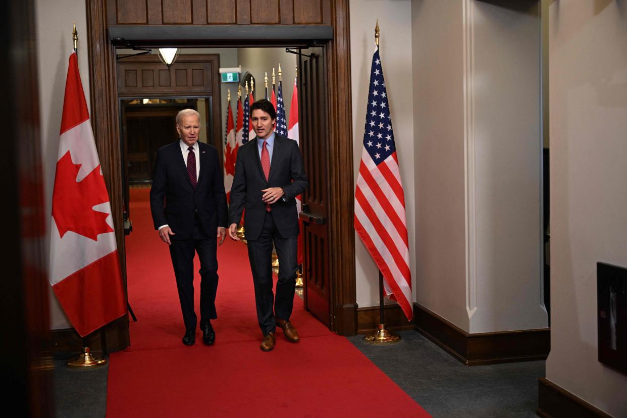 Canada's Prime Minister Justin Trudeau (R) walks with US President Joe Biden after welcoming him at Parliament Hill in Ottawa, Canada, on March 24, 2023. (Photo by MANDEL NGAN/AFP via Getty Images)