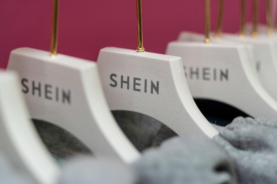The Shein logo on hangers at the SheIn Group Ltd. pop-up store in the Jervis Shopping Centre in Dublin, Ireland, on Tuesday, Nov. 8, 2022. 