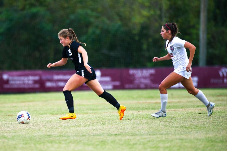 Bearden's Tyler Roth (19) kicks the ball during the Class AAA Region 2 tournament for high school girls varsity soccer at Bearden High School on Tuesday, Oct. 17, 2023.