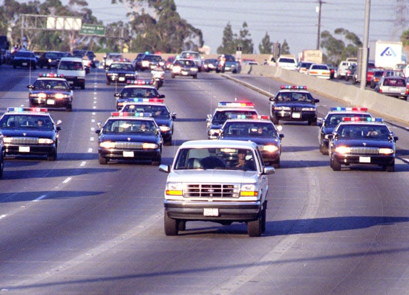 California Highway Patrol chase Al Cowlings, driving, and O.J. Simpson, hiding in rear of white Bronco on the 91 Freeway, just West of the I5 freeway. The chase ended in Simpson’s arrest at his Brentwood home. - Photo: Allen J. Schaben/Los Angeles Times (Getty Images)