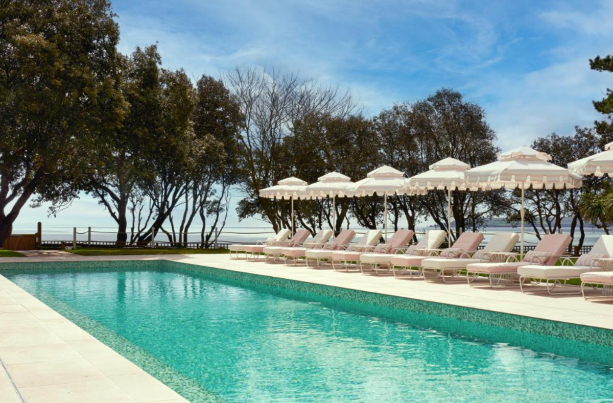 The Nici’s heated outdoor pool, ringed by bubblegum-pink parasols, is a joy (Booking.com)