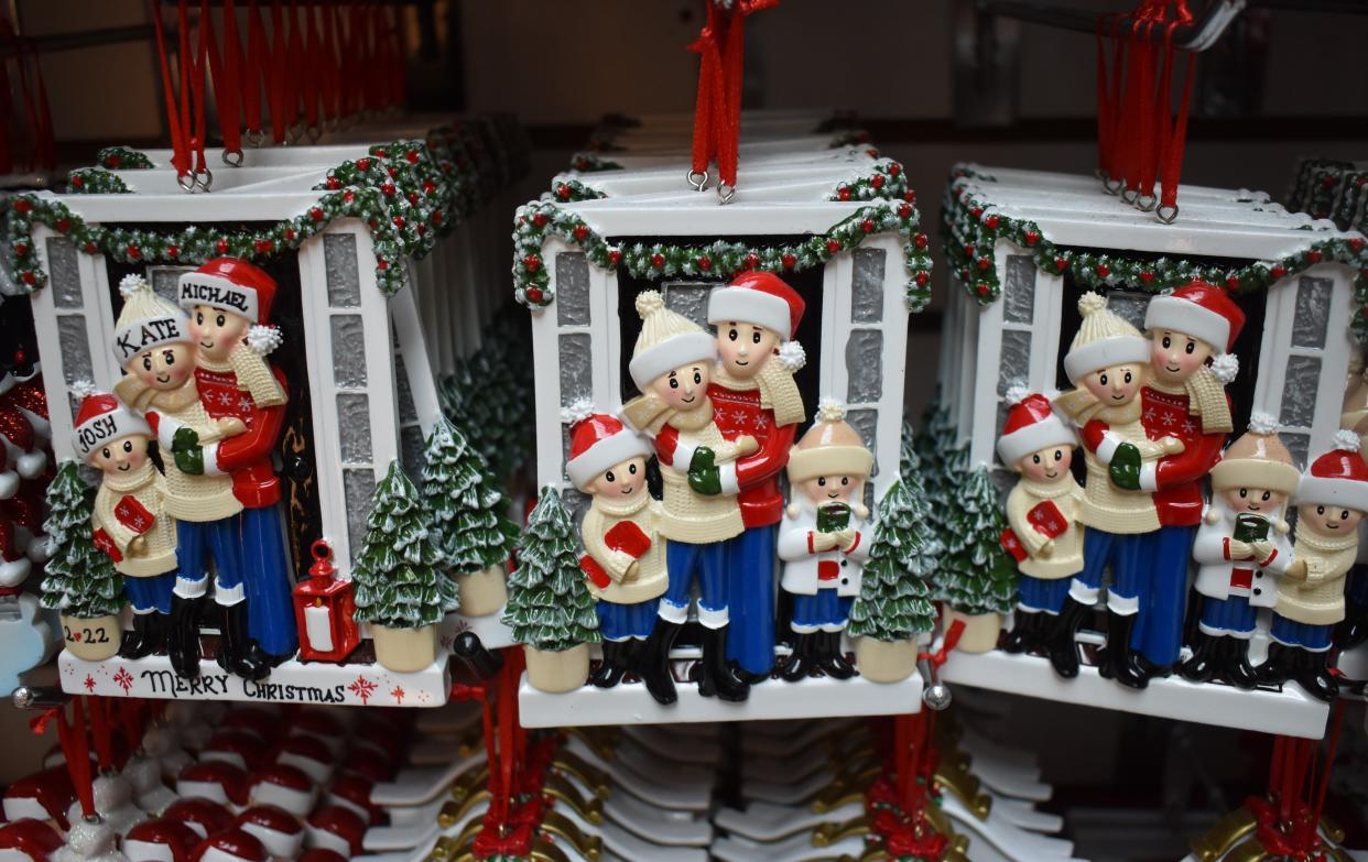 Ornaments wait for a shopper's holiday tree at Christmas Treasure, a kiosk at the Cherry Hill Mall.