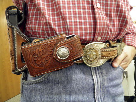 The Investigative Services Unit of the Oklahoma Department of Agriculture, Food, and Forestry (ODAFF) Special Agent Ricky Rushing wears a hand-tooled belt and holster at the agency's headquarters in Oklahoma City, Oklahoma September 30, 2015. REUTERS/Jon Herskovitz