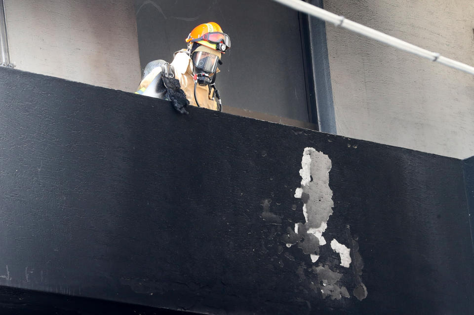<p>A firefighter looks around at a burnt hospital in Miryang, South Korea, Jan. 26, 2018. (Photo: Yonhap via Reuters) </p>