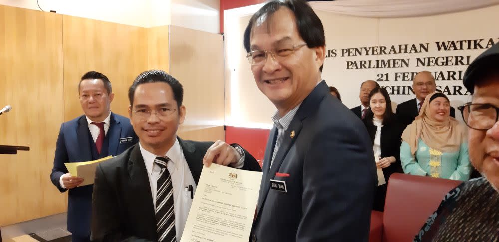 State Pakatan Harapan coordinator for Hulu Rajang parliamentary constituency Abun Sui Anyit (left) receiving his letter of appointment from state PKR chief Baru Bian February 21, 2020. — Picture by Sulok Tawie