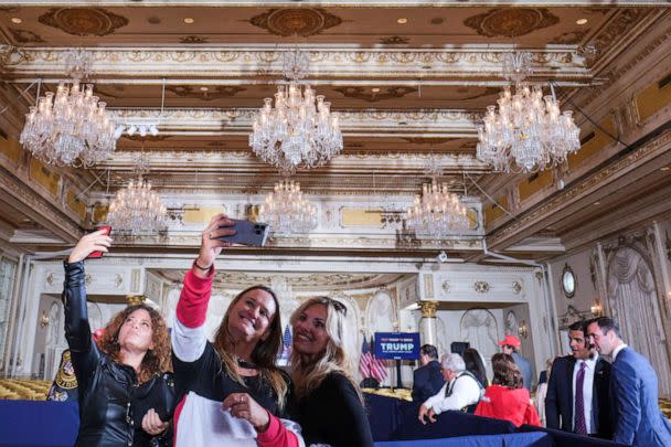 PHOTO: Women take selfies at Mar-a-Lago resort in Palm Beach, Florida, Apr. 4, 2023. (Ricardo Arduengo/Reuters)