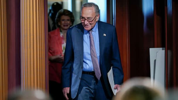 PHOTO: Senate Majority Leader Chuck Schumer followed by Sen. Debbie Stabenow, arrives to speak to reporters, July 26, 2022, at the Capitol in Washington, D.C. (J. Scott Applewhite/AP, FILE)