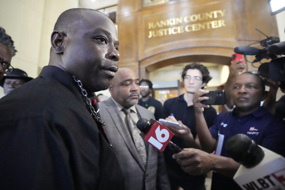 Eddie Terrell Parker, left, speaks with reporters following a hearing where six former Mississippi law officers pleaded guilty to state charges at the Rankin County Circuit Court in Brandon, Miss., Monday, Aug. 14, 2023. The six officers pleaded guilty to torturing Parker and another Black man in a racist assault. (AP Photo/Rogelio V. Solis)