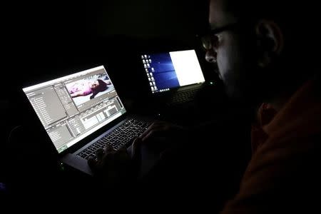 Director Humam Husari edits his film after finishing the filming at his office in the rebel held Douma neighbourhood of Damascus, Syria October 5, 2016. REUTERS/Bassam Khabieh