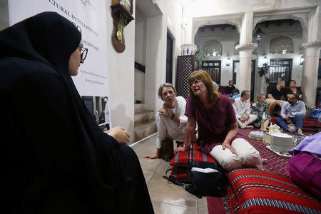 Tourists talk to an Emirati woman volunteer to learn about Ramadan and Emirati culture during the Muslim holy fasting month of Ramadan, at the Sheikh Mohammed Centre for Cultural Understanding (SMCCU) in Dubai, UAE May 17, 2019. REUTERS/Satish Kumar