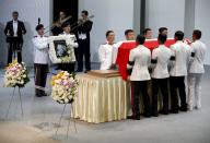 Pallbearers carry the casket of former leader Lee Kuan Yew as they depart for the final journey to the crematorium at the University Cultural Centre at the National University of Singapore March 29, 2015. Grieving Singaporeans were joined by world leaders on Sunday to pay their final respects to the country's first prime minister, Lee Kuan Yew, as the nation came to a near-halt to honour its "founding father". REUTERS/Edgar Su